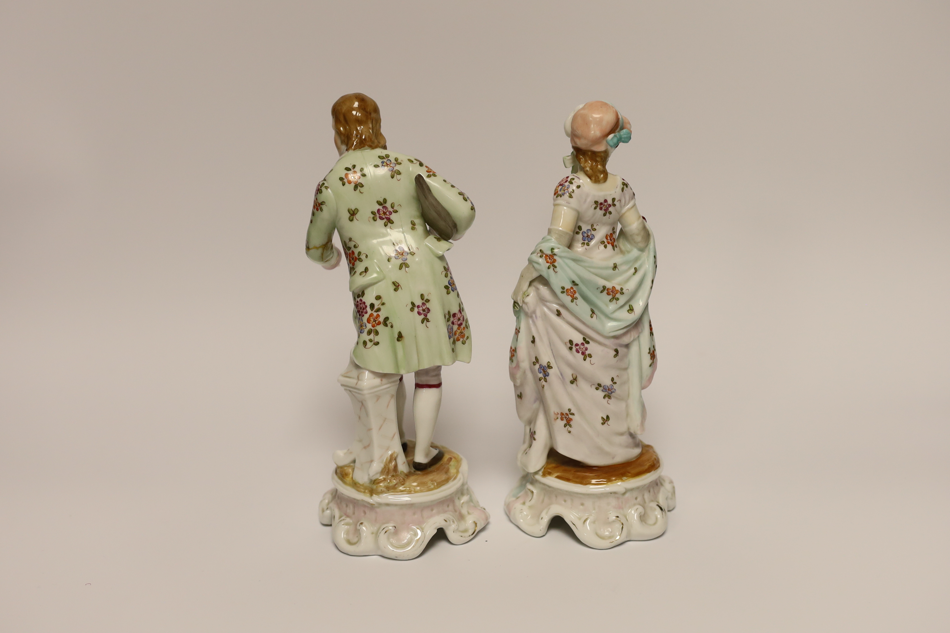 A pair of Sitzendorf figures, 21cm high